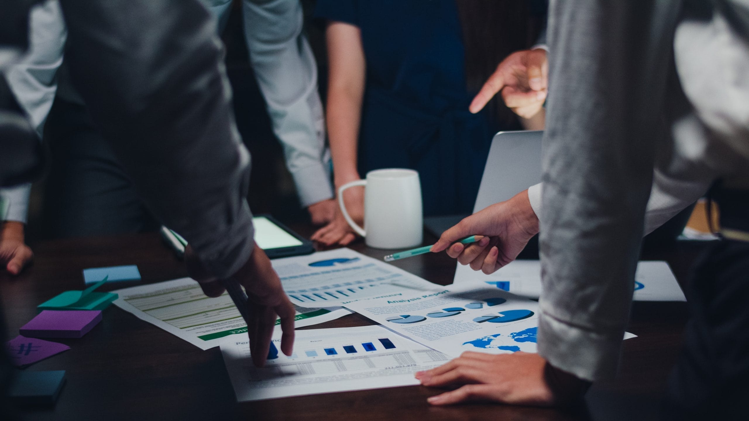 Millennial Asia Businessmen Businesswomen Meeting Brainstorming Ideas About New Paperwork Project Colleagues Working Together Planning Success Strategy Enjoy Teamwork Small Modern Night Office 1 Scaled